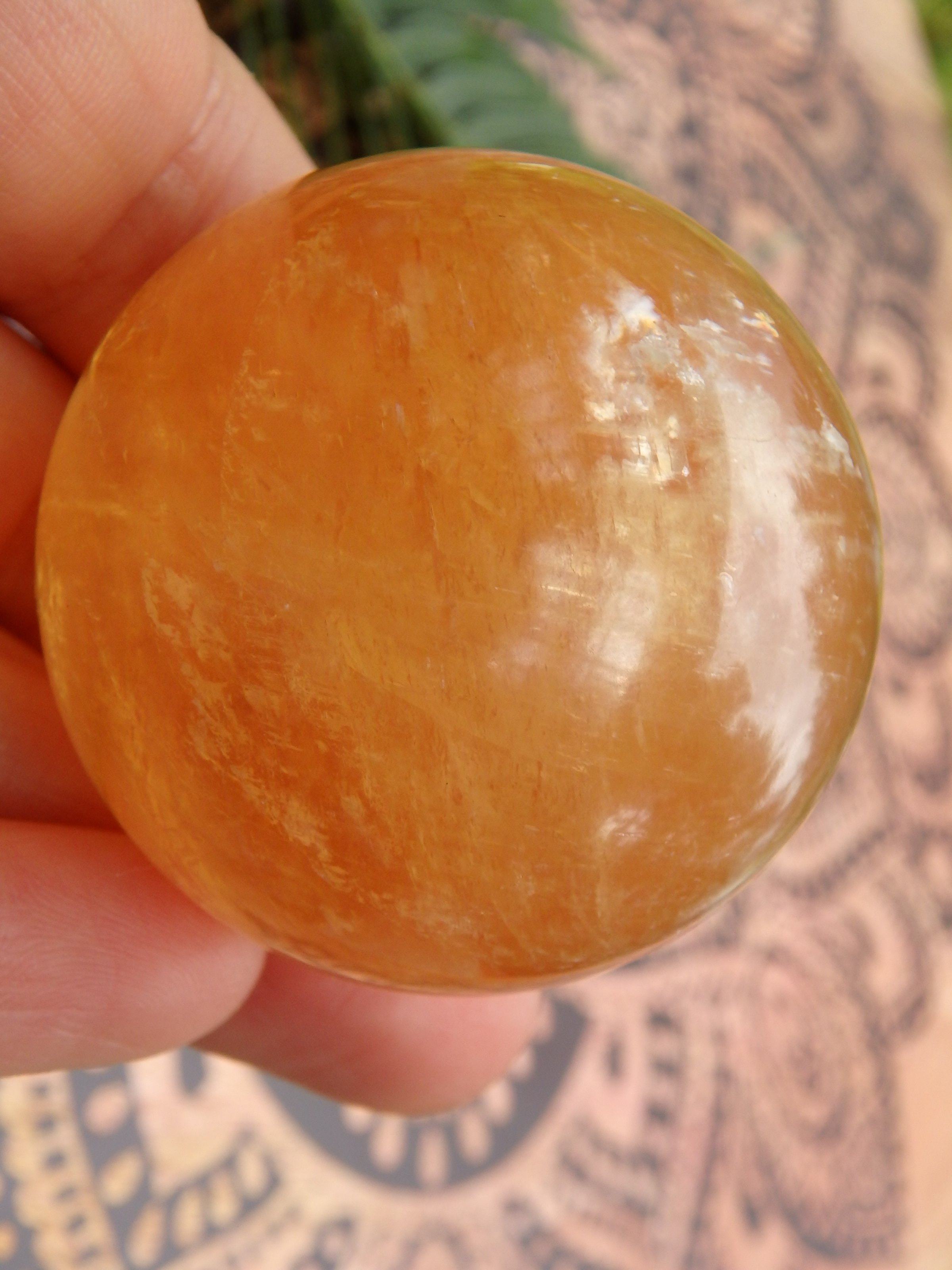 Brilliant Deep Orange Golden Calcite Sphere Carving 1 - Earth Family Crystals