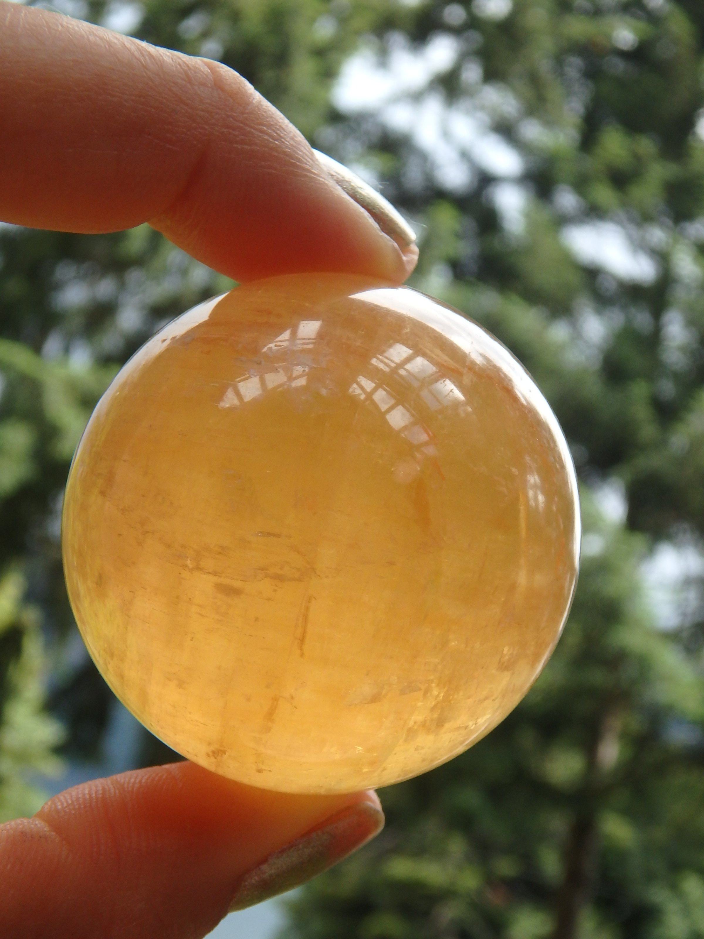 Brilliant Deep Orange Golden Calcite Sphere Carving 1 - Earth Family Crystals