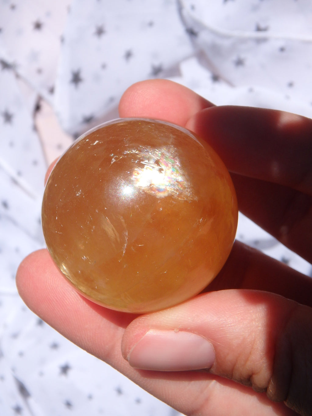 Uplifting Optical Golden Honey Calcite Sphere Carving With Rainbows 1 - Earth Family Crystals