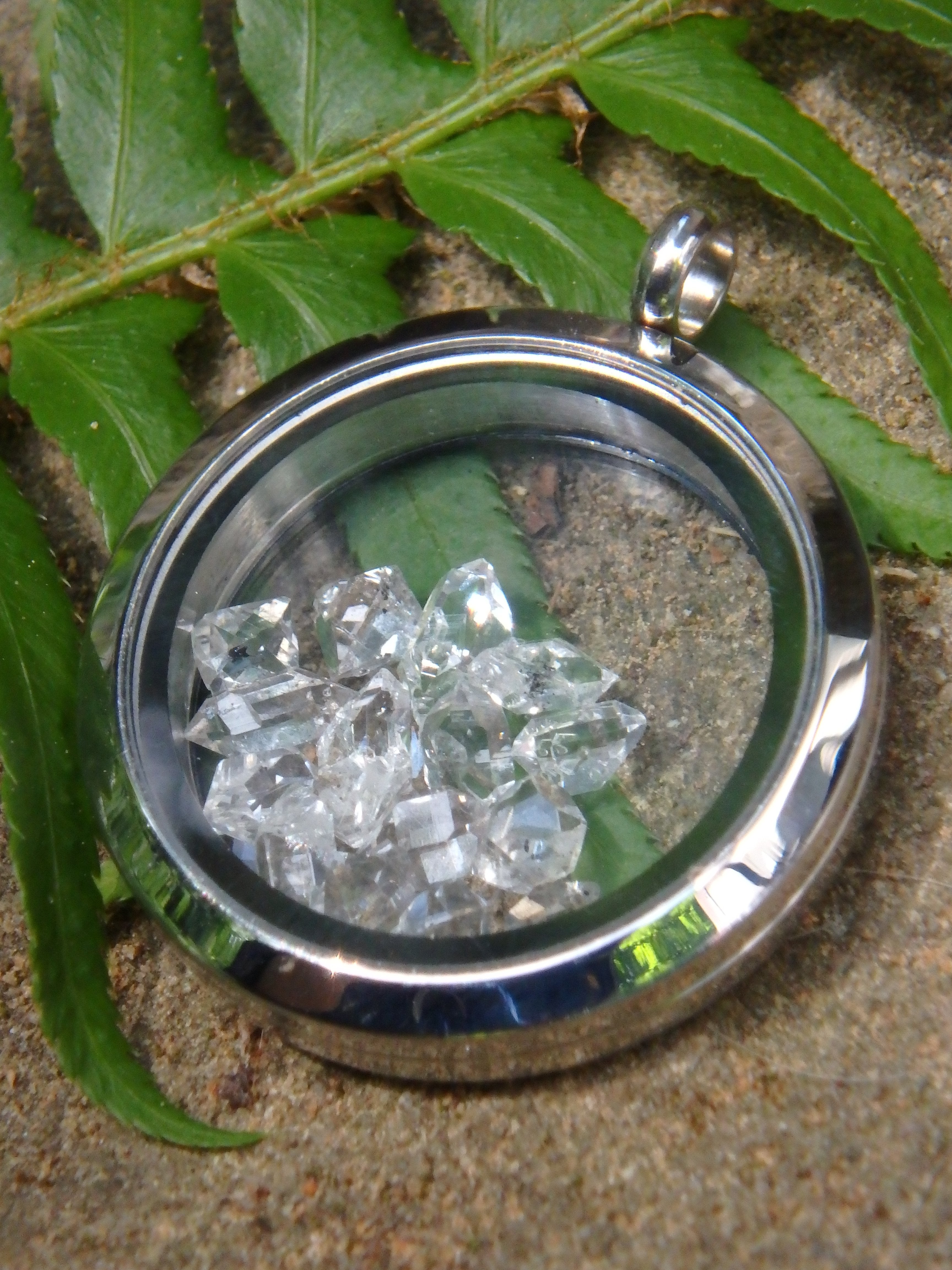 Extreme Brilliance Herkimer Diamonds Floating in Stainless Steel Locket Style Pendant (Includes Silver Chain) - Earth Family Crystals