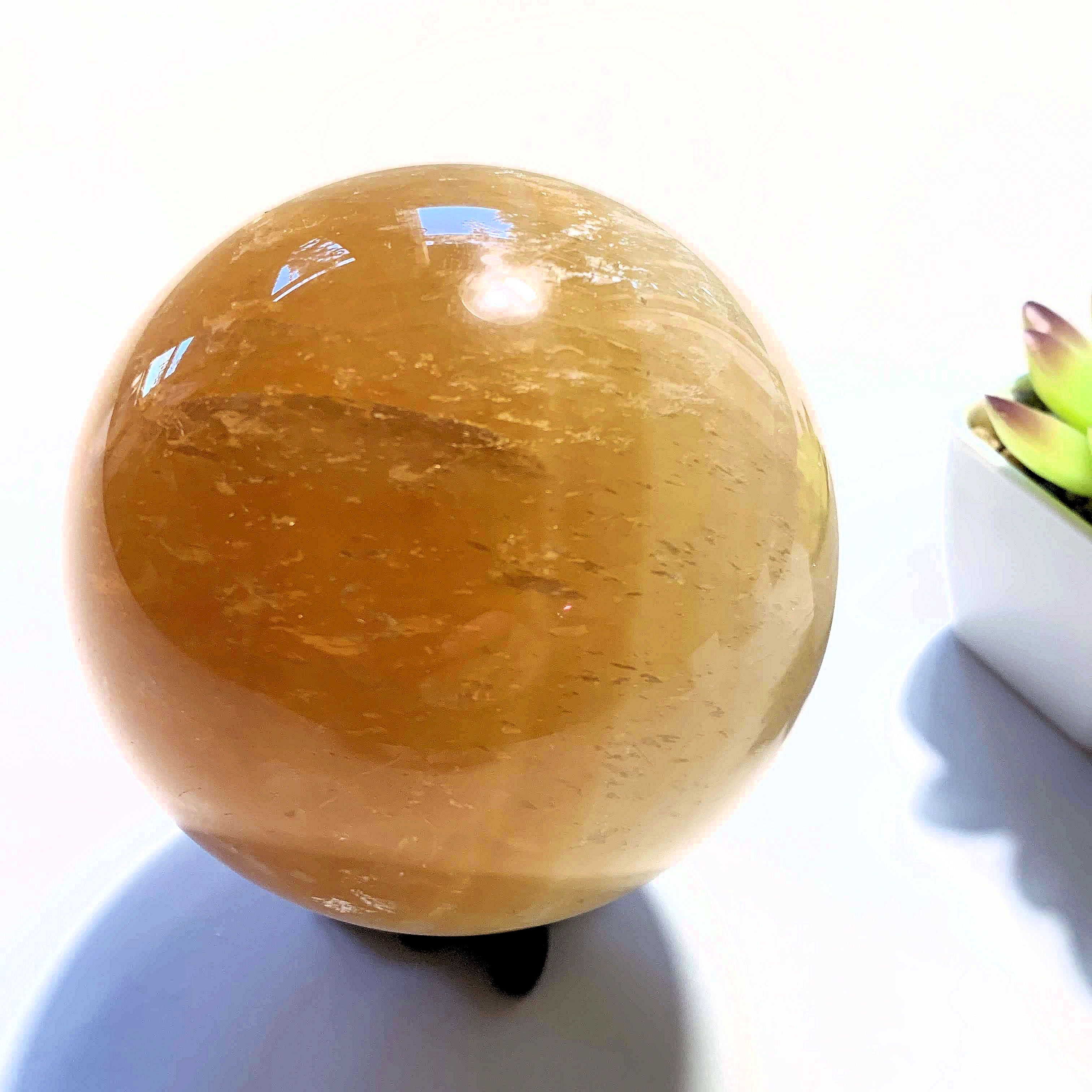 Uplifting XL  Golden Honey Calcite Sphere carving - Earth Family Crystals