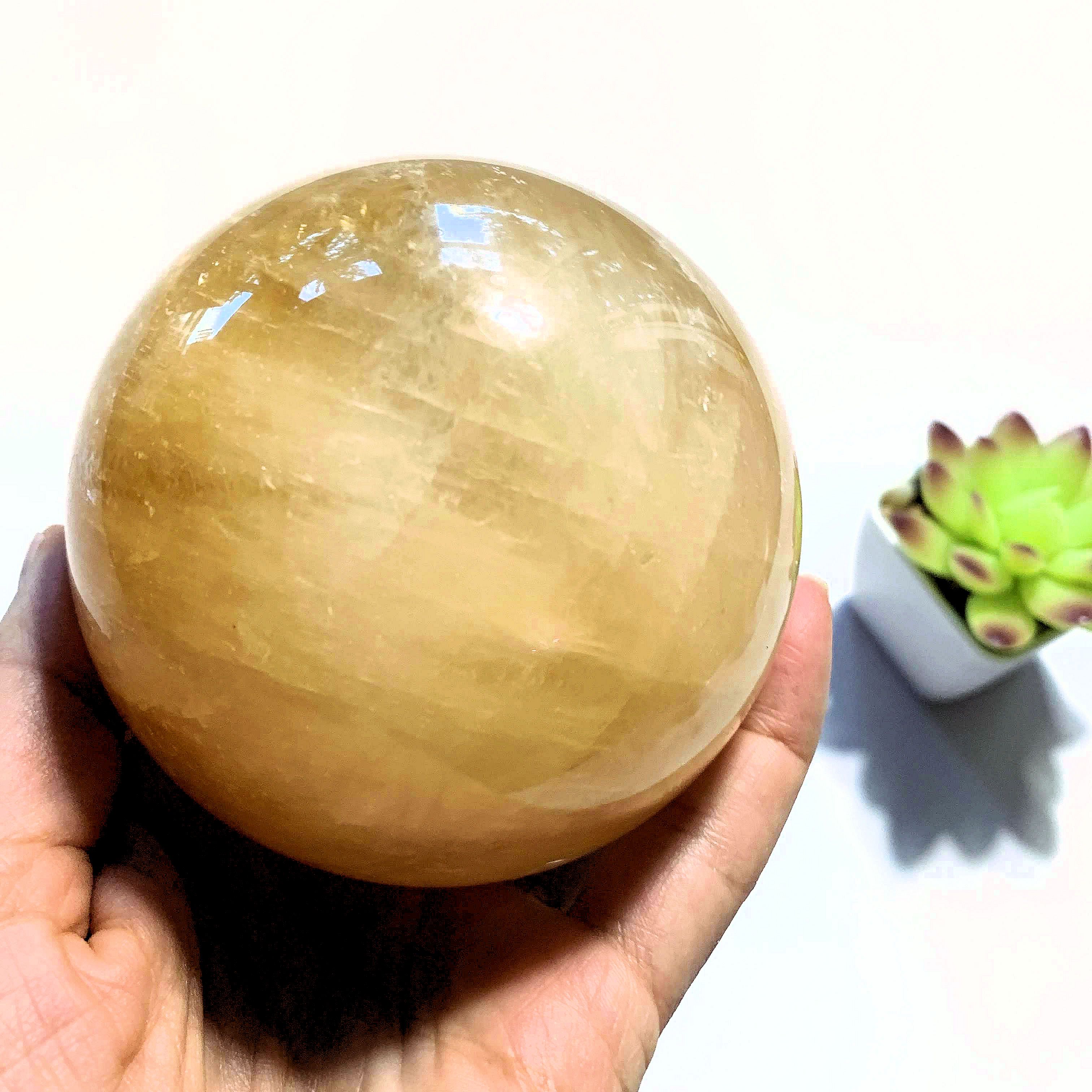 Uplifting XL  Golden Honey Calcite Sphere carving - Earth Family Crystals