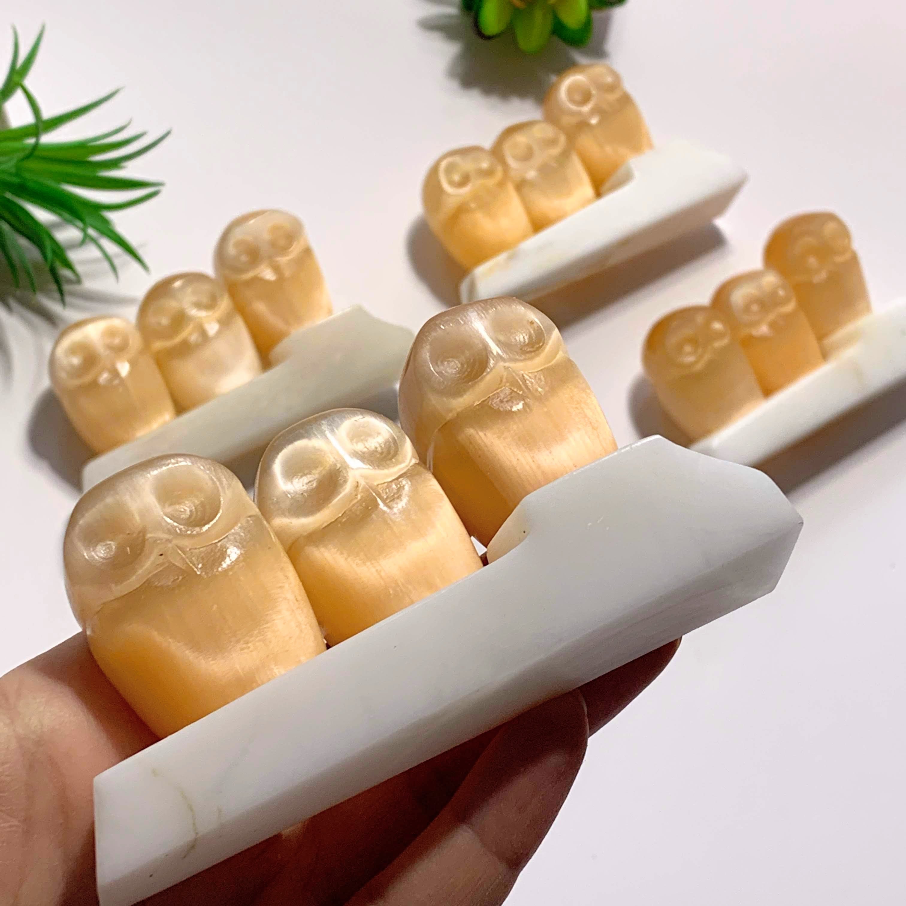 One Stunning Orange Selenite Owl Family Carving on Dolomite Stand