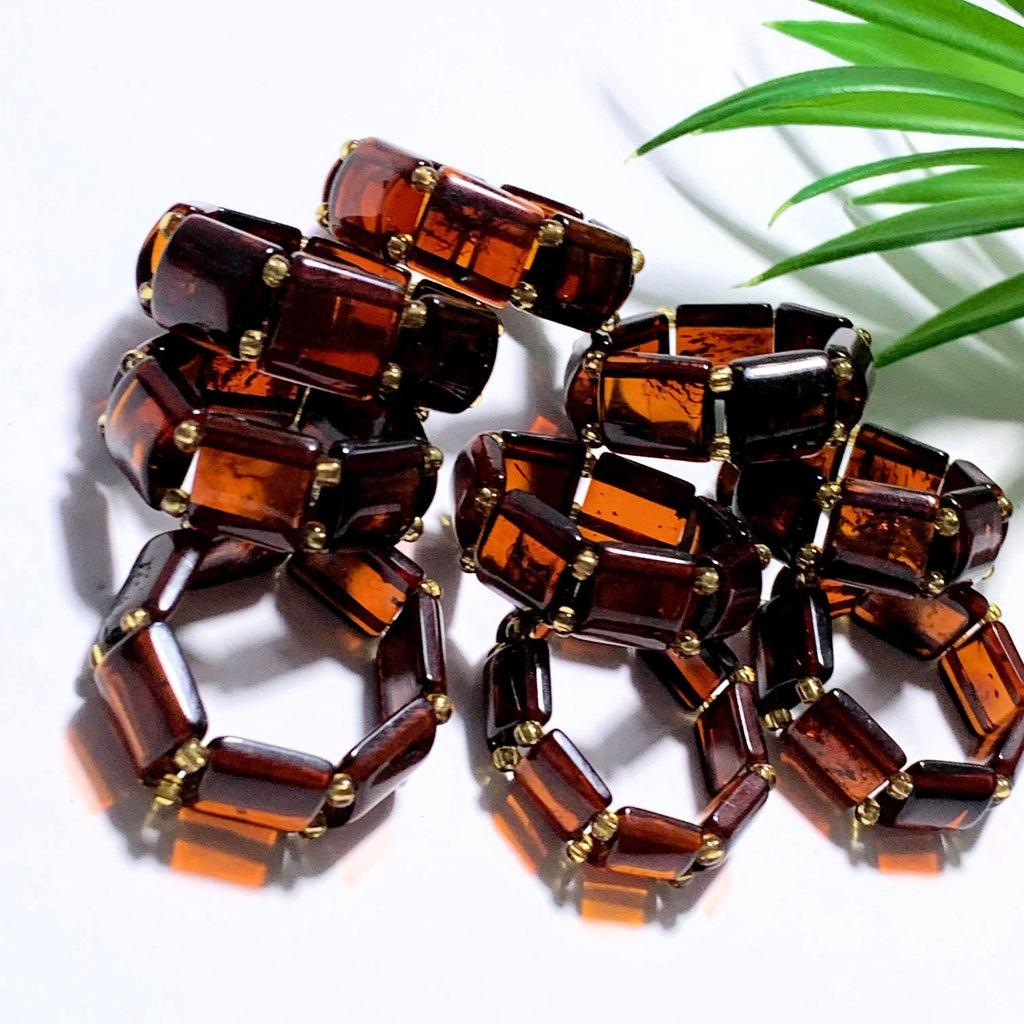 One Genuine Cherry Baltic Amber Ring on Stretchy Cord (Adjustable- Size 7-11) - Earth Family Crystals