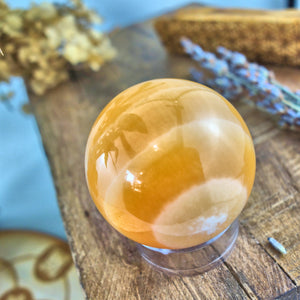 Swirls of Orange Calcite Sphere Carving - Earth Family Crystals