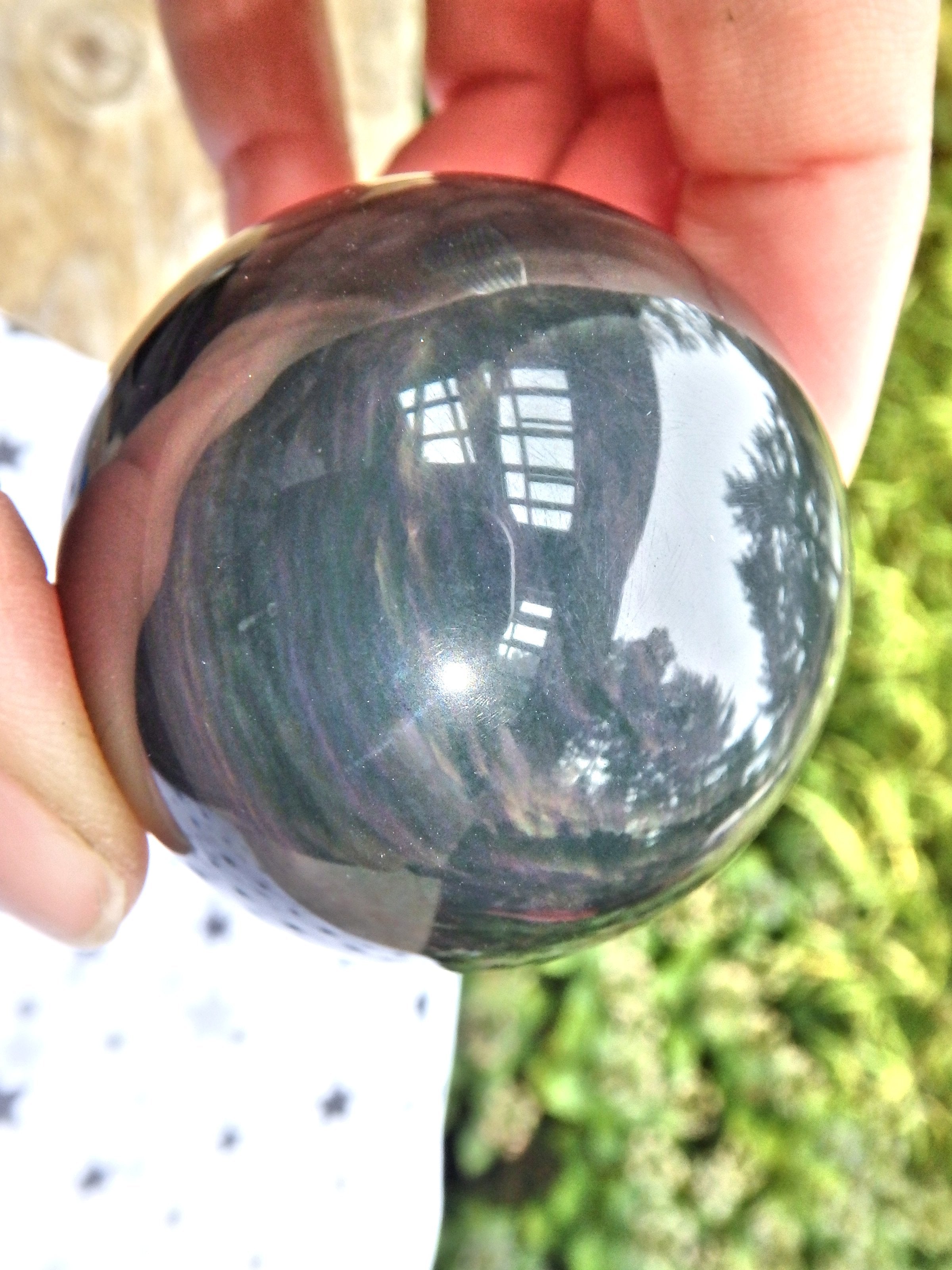 Mysterious Orbs of Flash Rainbow Obsidian Sphere Carving - Earth Family Crystals