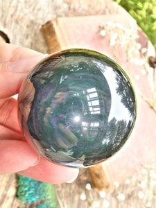 Mysterious Orbs of Flash Rainbow Obsidian Sphere Carving - Earth Family Crystals